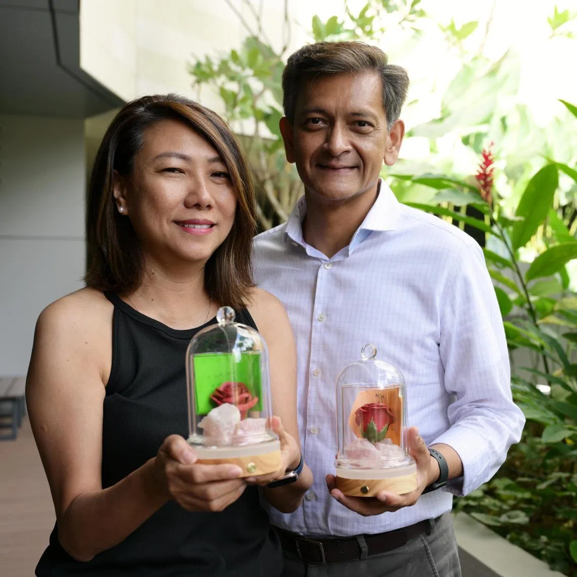 Retiree Lisa Ng, 56, commemorates her late father Simon Ng at Dover Park Hospice?s Rose for Remembrance event where ?memory jars? containing items like rose quartz, a rose, specially-blended scents and handwritten notes are made to evoke cherished memories of departed loved ones. Lisa and her husband board director Mr Aloysius Arlando, 56.
