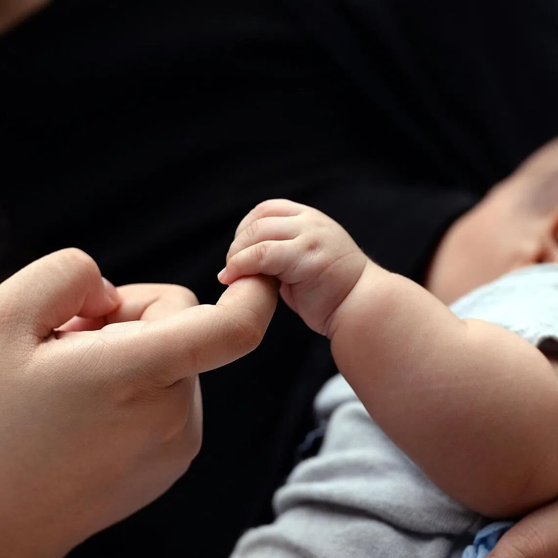 A teenage mother with her baby son.