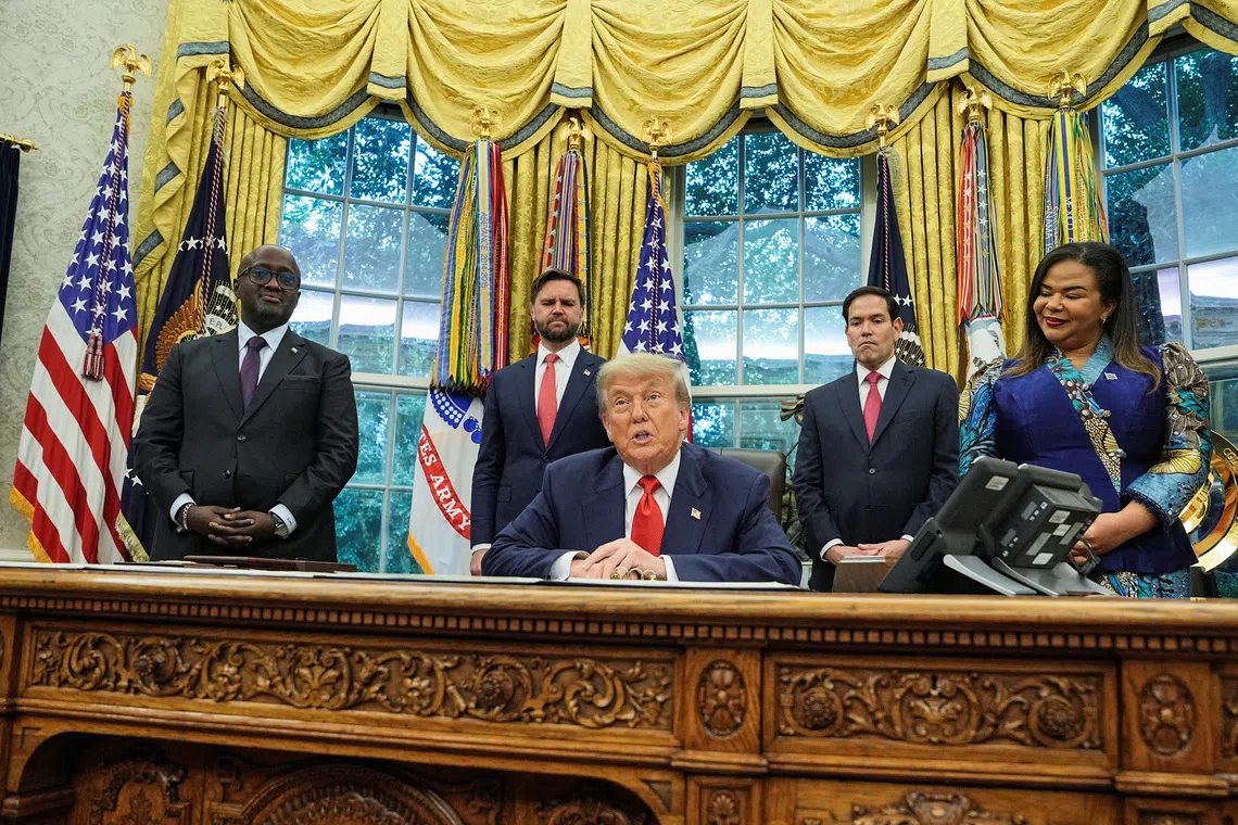 U.S. President Donald Trump speaks during a meeting with Democratic Republic of the Congo's Foreign Minister Therese Kayikwamba Wagner and Rwanda's Foreign Minister Olivier Nduhungirehe in the Oval Office at the White House in Washington D.C., June 27, 2025. REUTERS/Ken Cedeno