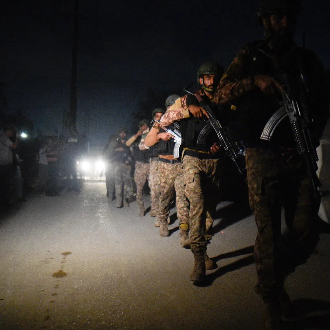 Security personnel patrols after an explosion and gunfire were reported, near offices of the Rangers, a paramilitary force, in Karachi, Pakistan, June 27, 2026. REUTERS/ Qaiser Khan