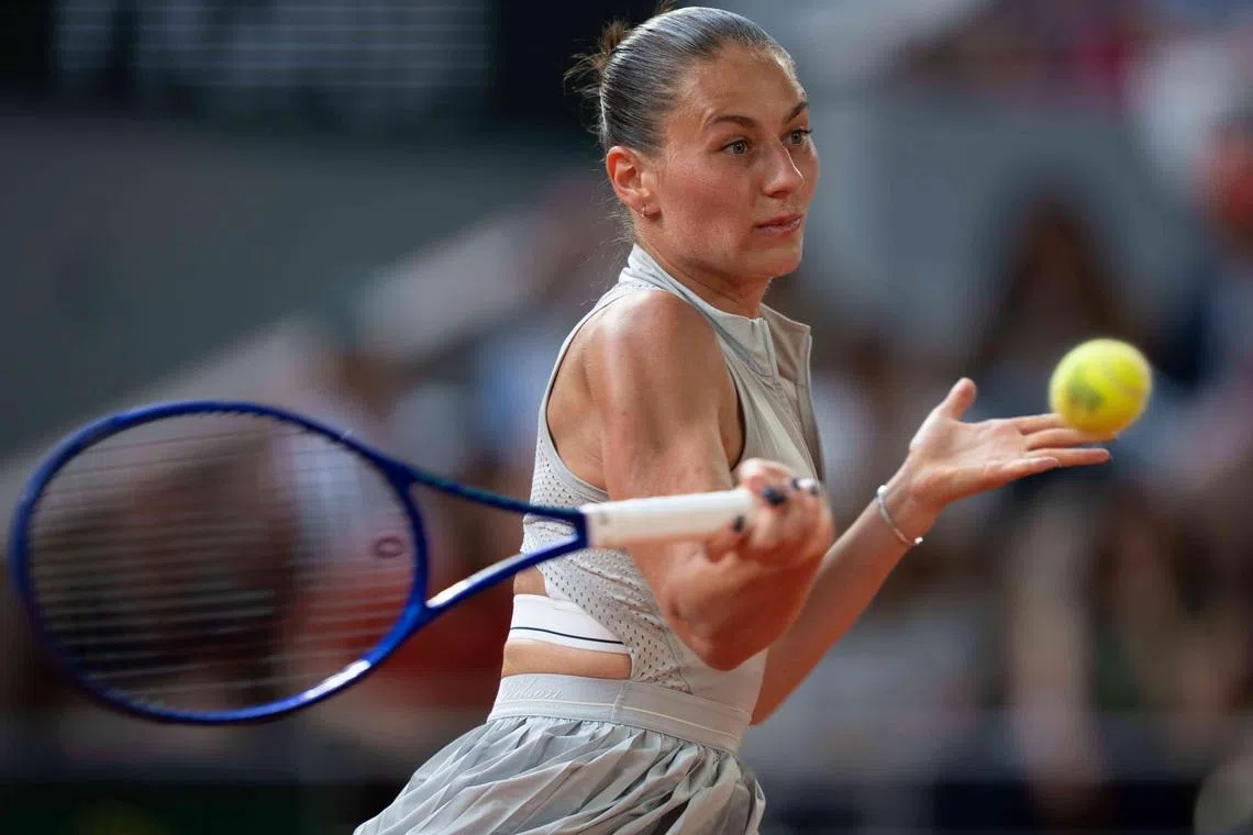 Jun 4, 2026; Paris, France;  Marta Kostyuk of Ukraine returns a shot during her match against Mirra Andreeva on day 12 at Stade Roland Garros. Mandatory Credit: Susan Mullane-Imagn Images