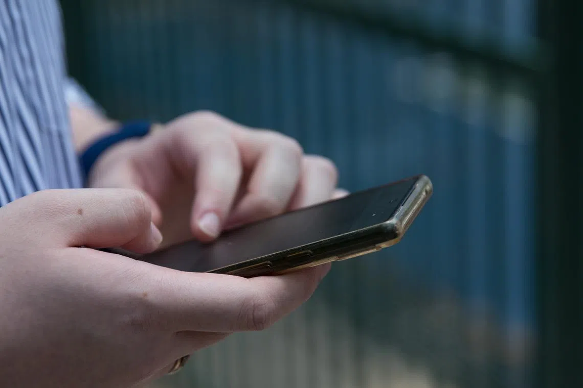 Generic image of phone user; can be used for stories about the impact of digital technology on changing consumer behaviours.