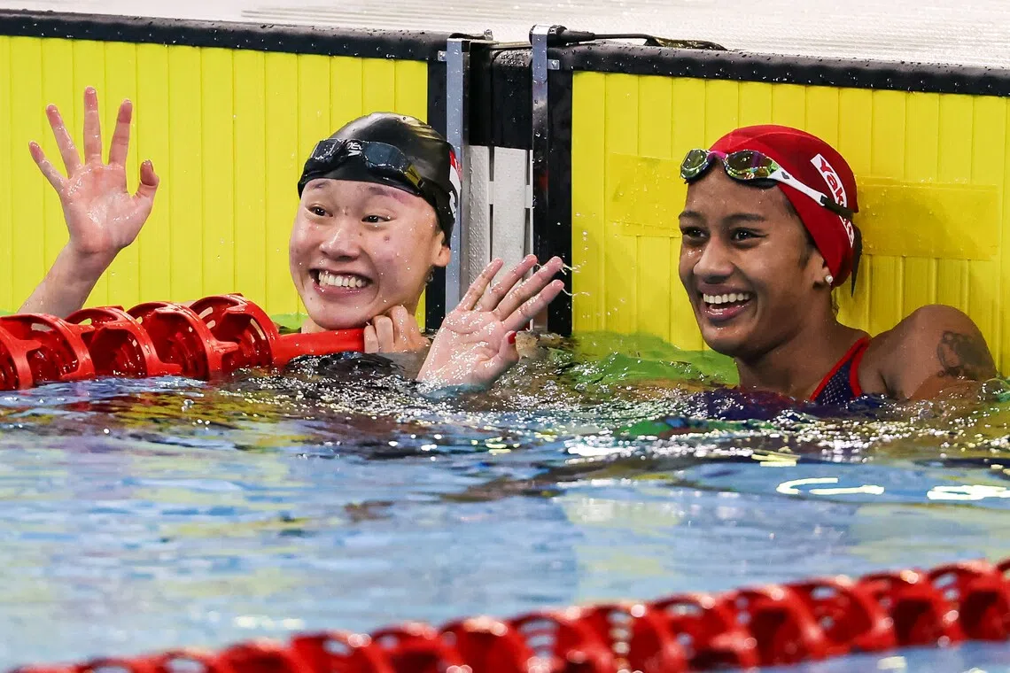 Singapore’s Gan Ching Hwee (left) with Thailand’s Kamonchanok Kwanmuang after the women’s 400m final on Dec 12.