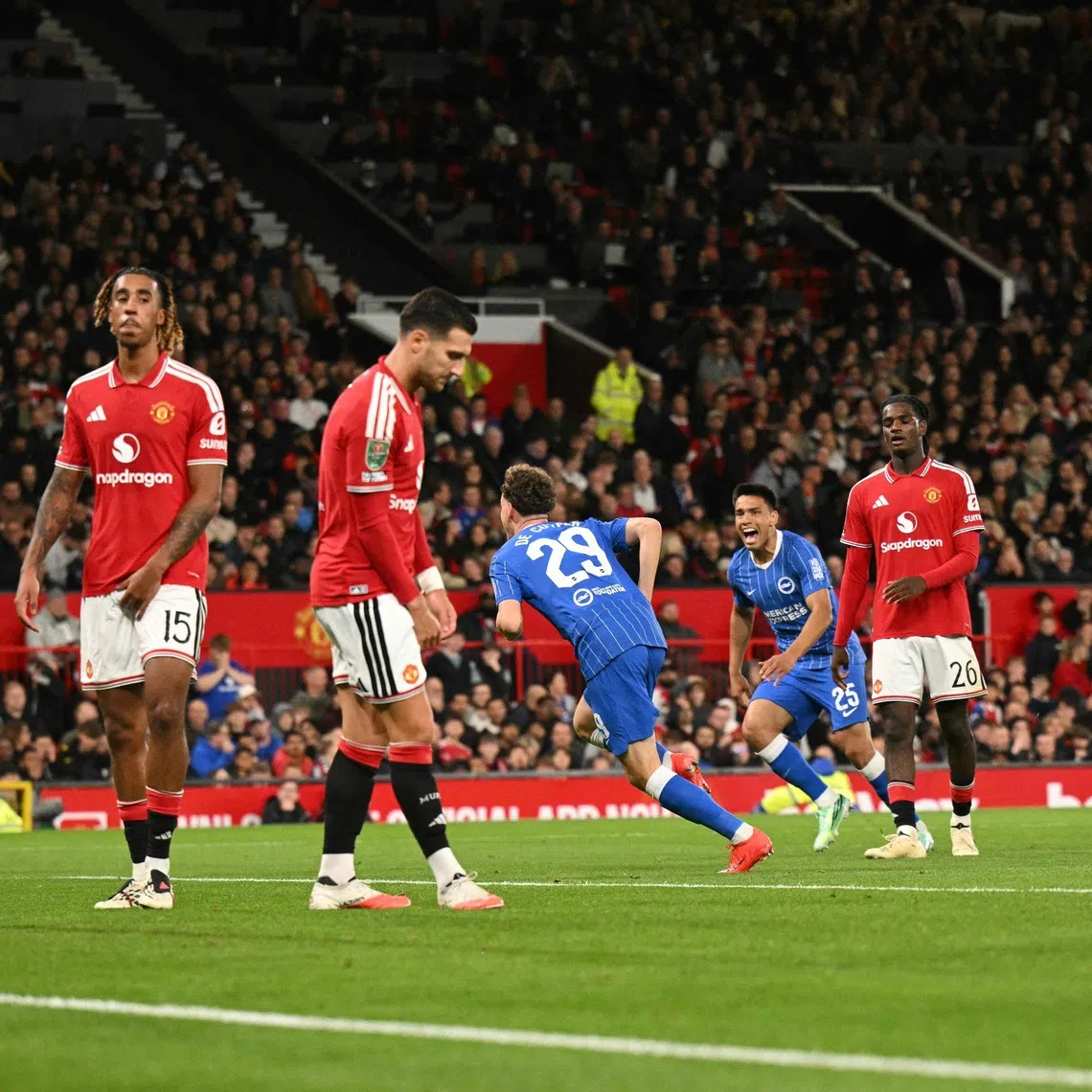 Brighton’s Belgian defender Maxim De Cuyper celebrates scoring the team’s third goal against Manchester United at Old Trafford.