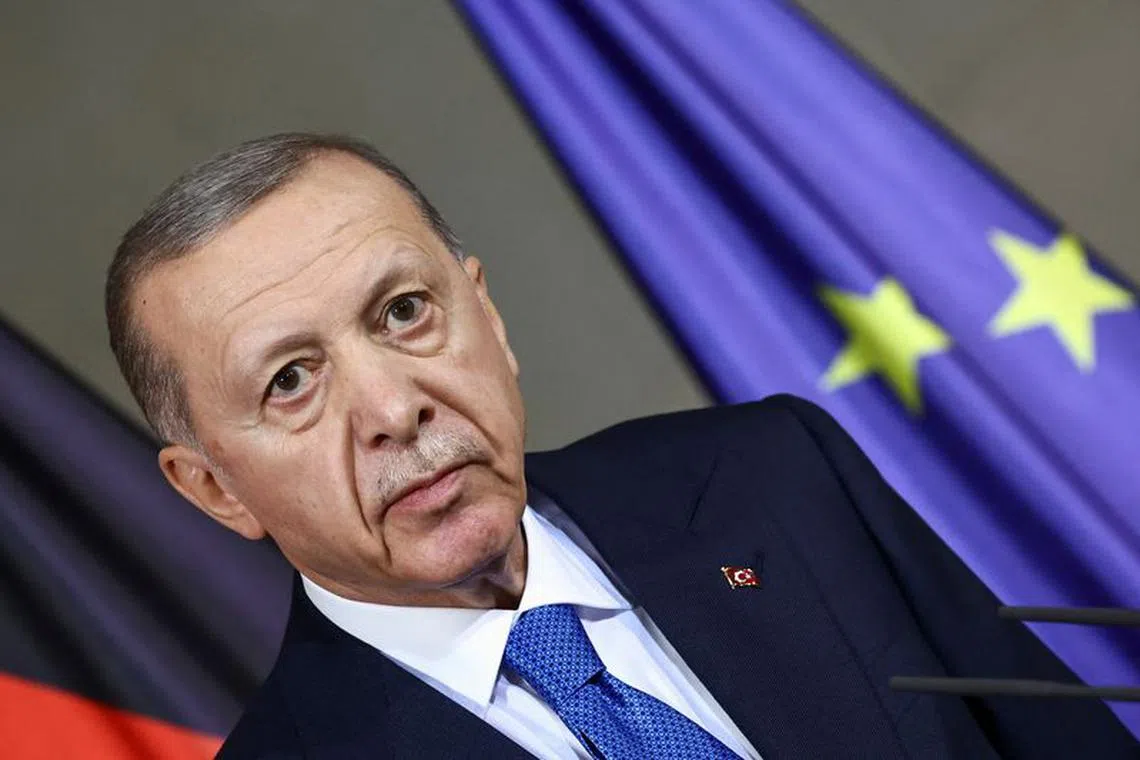 FILE PHOTO: Turkish President Tayyip Erdogan attends a press conference with German Chancellor Olaf Scholz (not pictured) at the Chancellery in Berlin, Germany, November 17, 2023. REUTERS/Liesa Johannssen/File Photo
