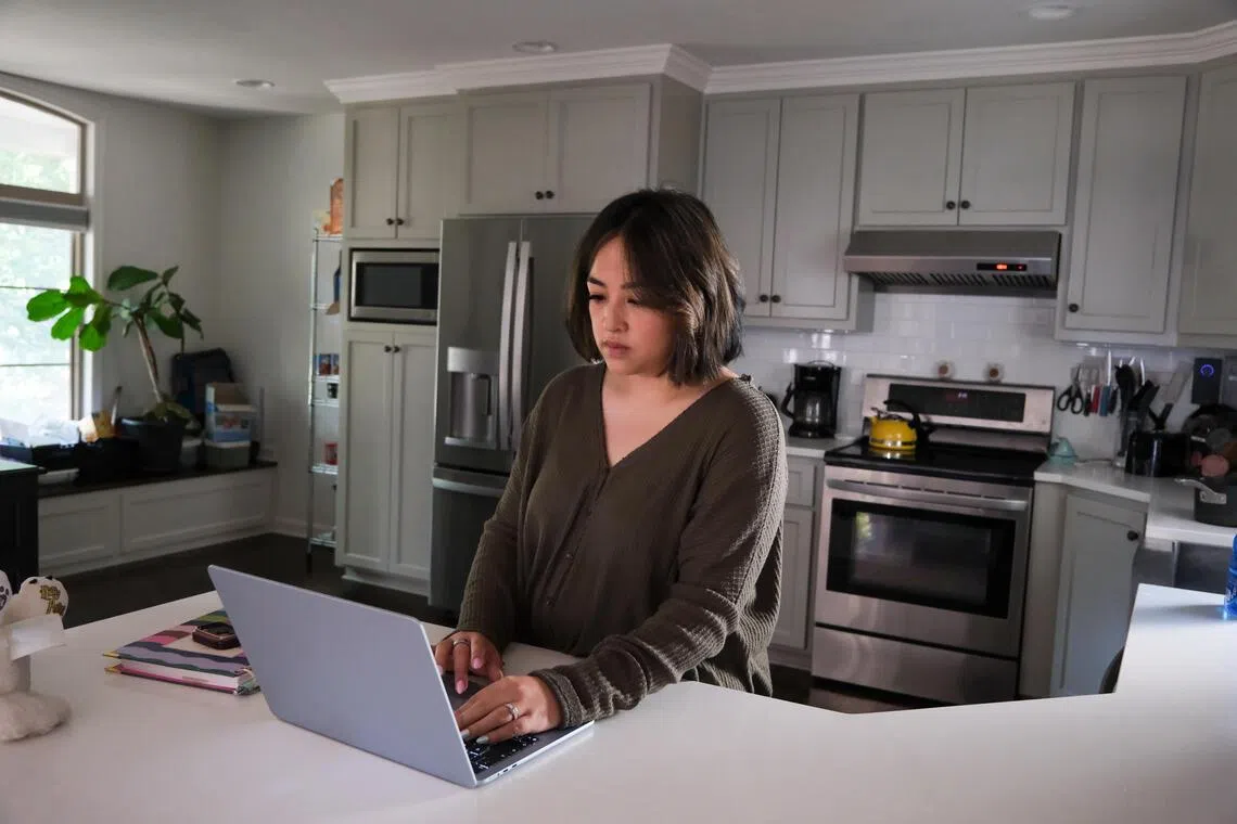 Lisa Green checks the Ollie Assistant from her computer at her home in Kansas City on Oct 3.
