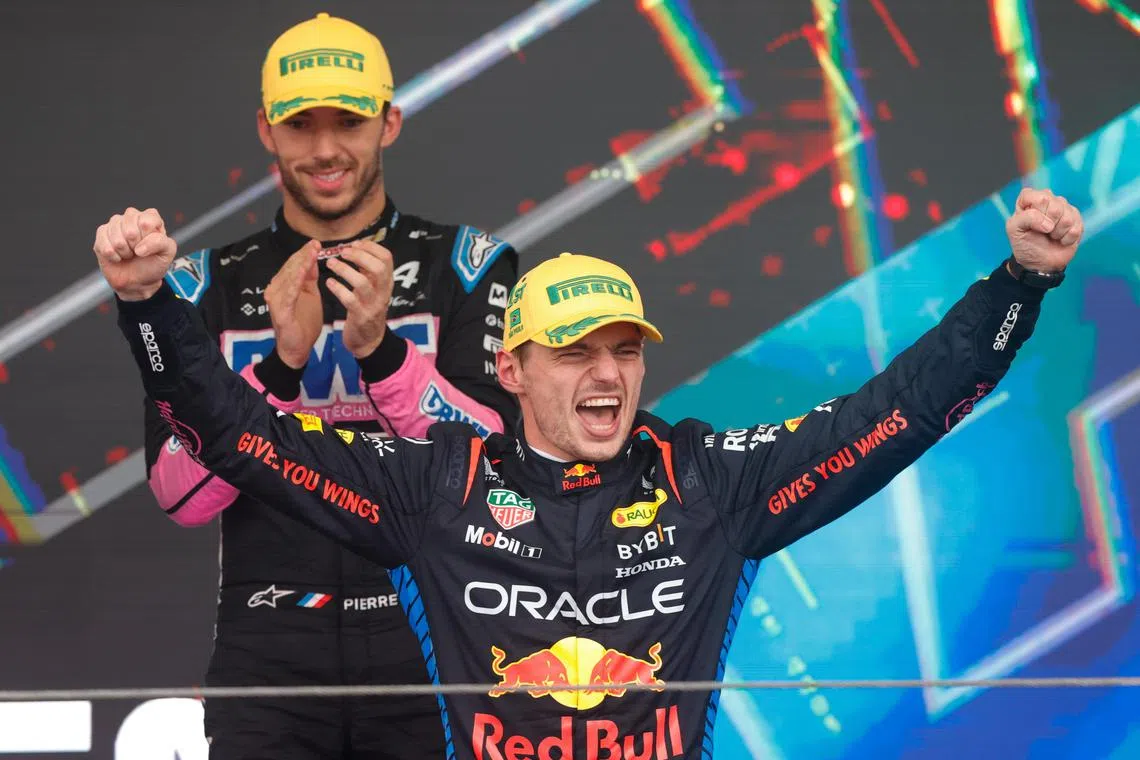 epa11700158 Red Bull's Max Verstappen (R) celebrates on the podium at the Formula One Sao Paulo Grand Prix in Sao Paulo, Brazil, 03 November 2024.  EPA-EFE/ANDRE COELHO