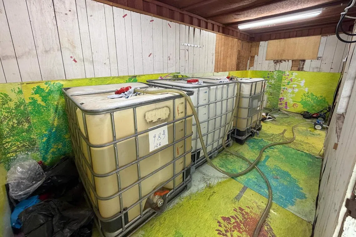 Motor spirit containers seized in an illicit fuel storage site during an anti-illicit fuel operation in Hong Kong.