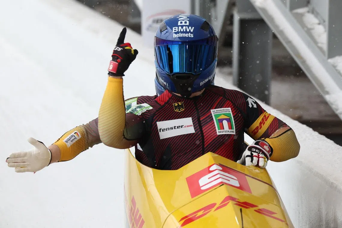 FILE PHOTO: Bobsleigh and Skeleton - IBSF World Championships - Mount Van Hoevenberg, Lake Placid, New York, United States - March 9, 2025 Germany's Francesco Friedrich and Alexander Schuller celebrate after winning the 2-man Bobsleigh REUTERS/Brendan Mcdermid/File Photo