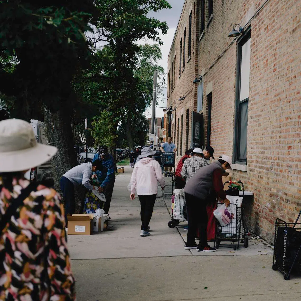 People queuing outside of Pilsen Food Pantry in Chicago on Oct 8. 