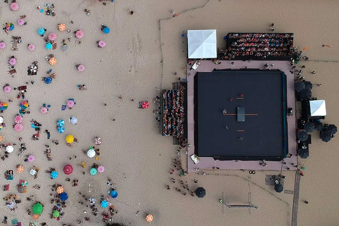 An aerial view taken during the Teqball Tour women's doubles final match between Brazil's Vasco da Gama Ester Viana and Vania Moraes against Hungary's Krisztina Acs and Gabriella Kota at Copacabana beach in Rio de Janeiro, Brazil, on Sept 10.