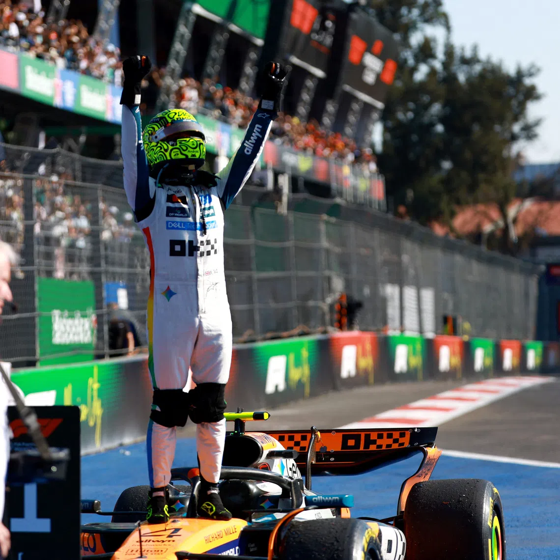 McLaren's Lando Norris celebrates after winning the Mexico City Grand Prix.