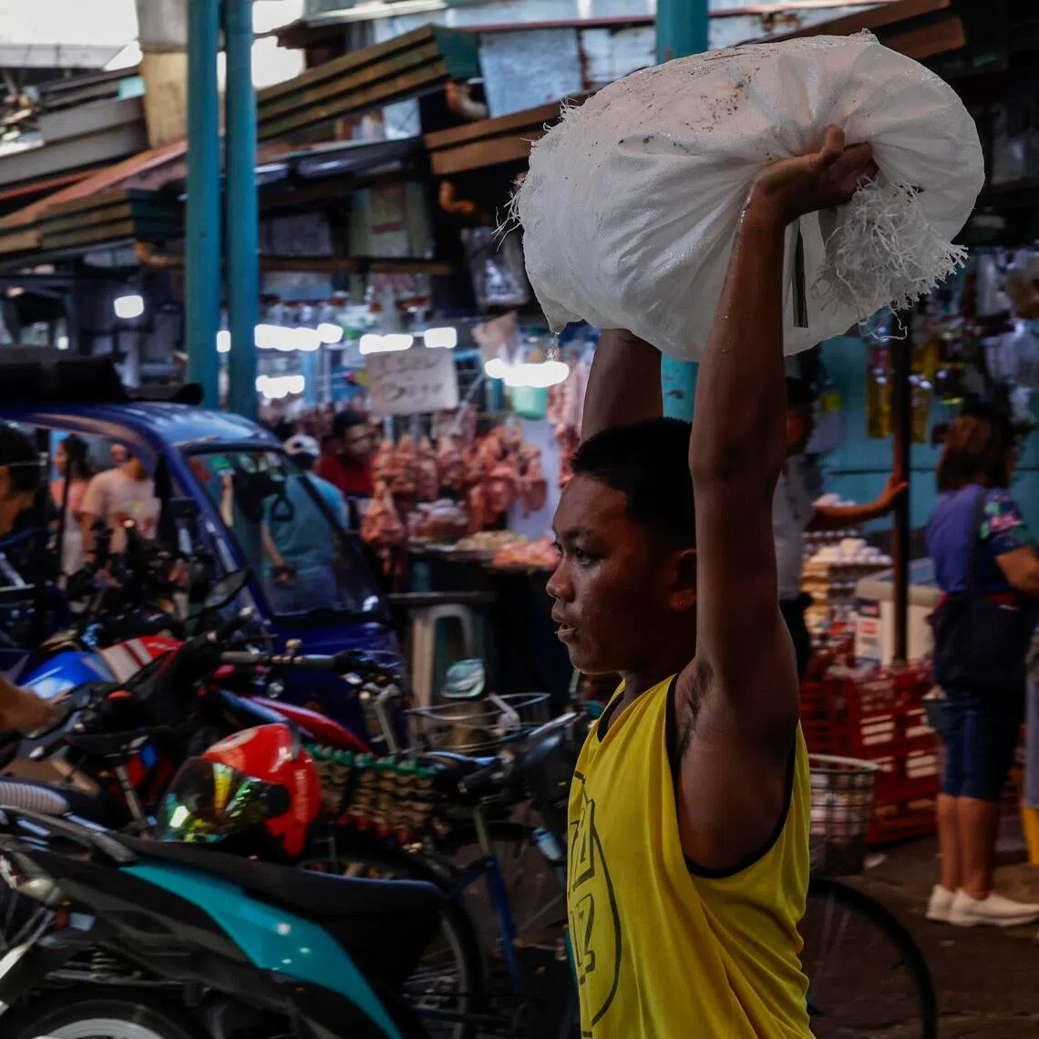 A vendor carries a sack of ice at a market in Marikina City, Metro Manila, Philippines, 05 May 2026. 