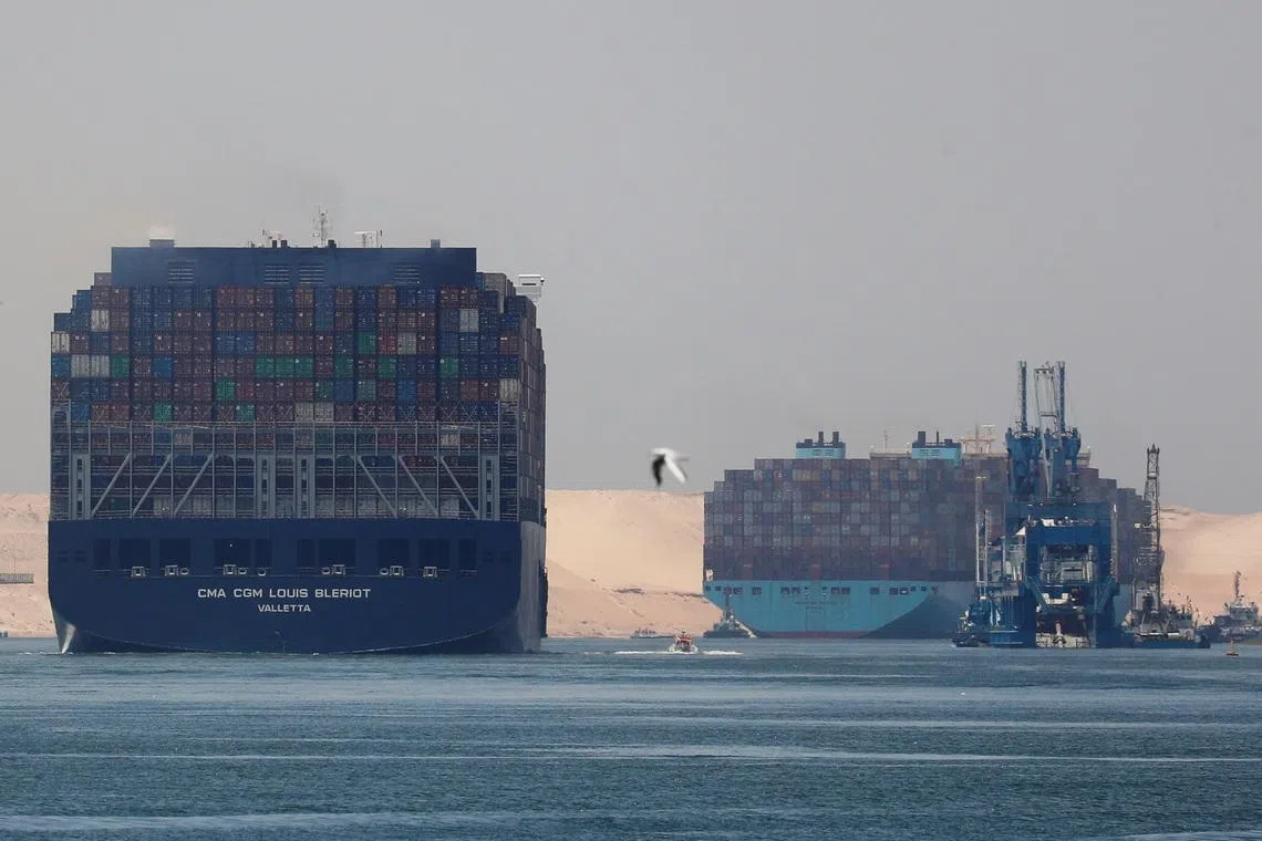 CMA CGM Louis Bleriot and a Maersk Line container ship pass through the Suez Canal in Ismailia, Egypt July 7, 2021. Picture taken July 7, 2021. REUTERS/Amr Abdallah Dalsh