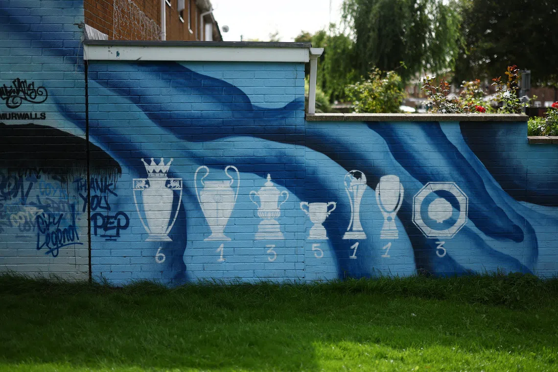 Soccer Football - Premier League - Manchester City v Sunderland - Etihad Stadium, Manchester, Britain - September 20, 2026 A mural of trophies won by Manchester City on a wall outside the stadium before the match Action Images via Reuters/Lee Smith