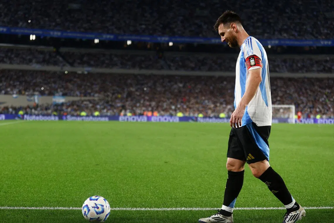 FILE PHOTO: Soccer Football - World Cup - South American Qualifiers - Argentina v Bolivia - Estadio Mas Monumental, Buenos Aires, Argentina - October 15, 2024 Argentina's Lionel Messi with the match ball after the match after completing his hat-trick REUTERS/Matias Baglietto/File Photo