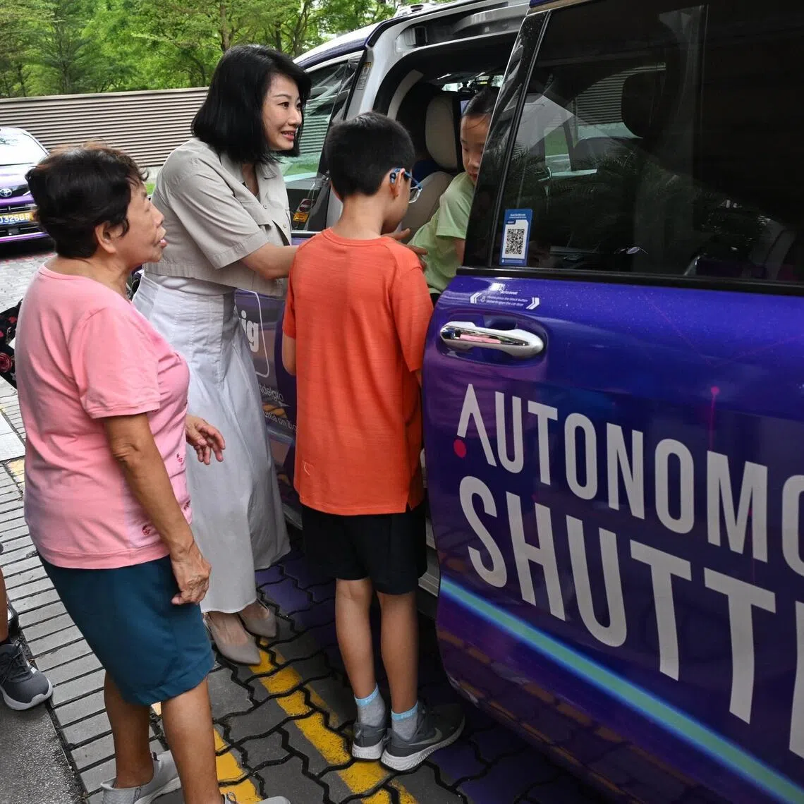 Senior Minister of State for Transport Sun Xueling with residents during the launch of ComfortDelGro’s free driverless shuttle rides in Punggol on June 22.