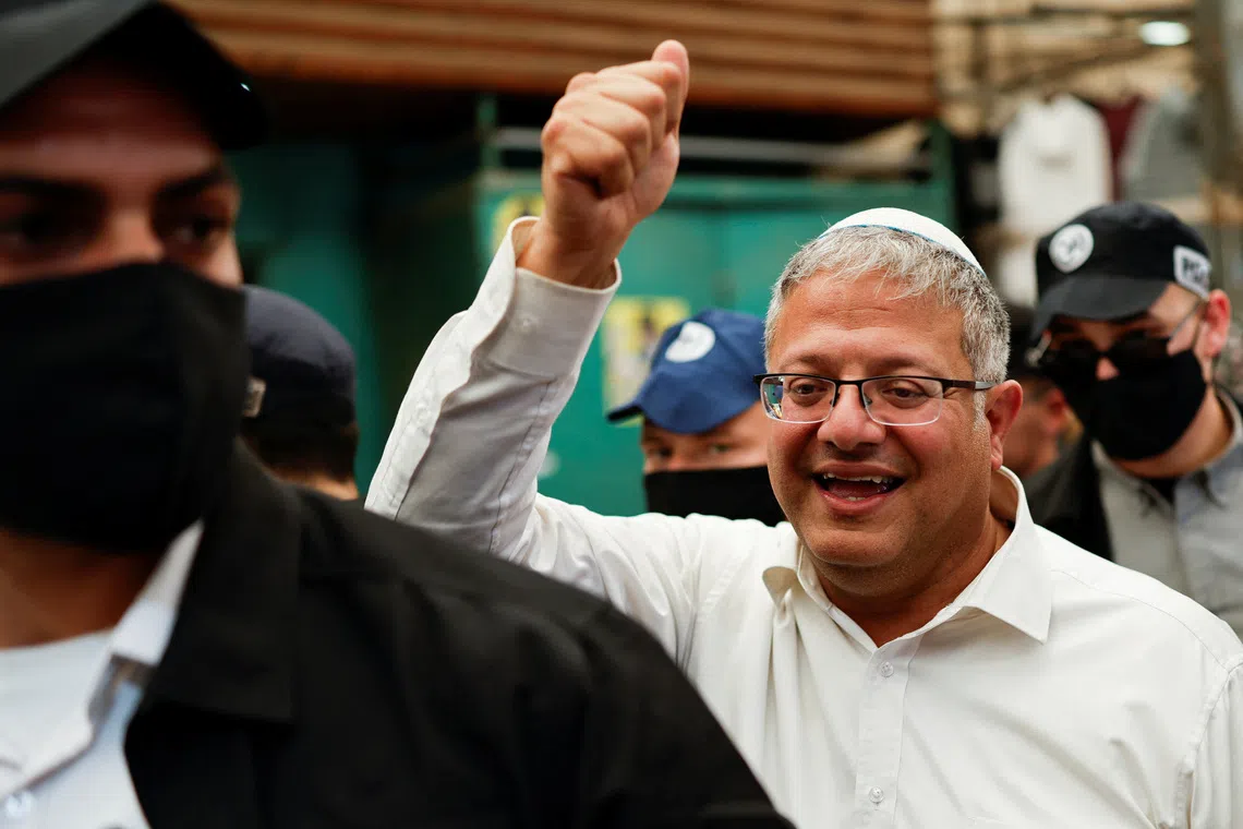 Israeli far-right National Security Minister Itamar Ben-Gvir, leader of the Jewish Power (Otzma Yehudit) party, gestures as he tours a market, ahead of Israel’s national election, in Ramla, Israel, on Oct 14.