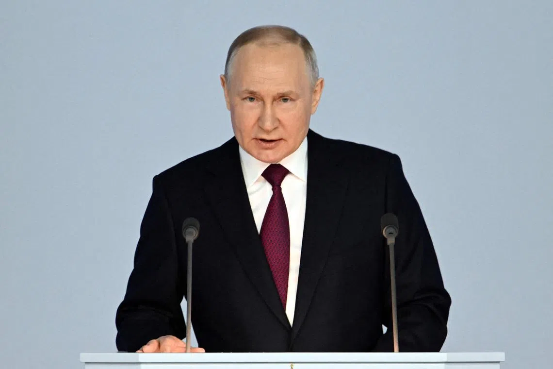 Russian President Vladimir Putin delivers his annual state address at the Gostiny Dvor conference centre in Moscow, on Feb 21.