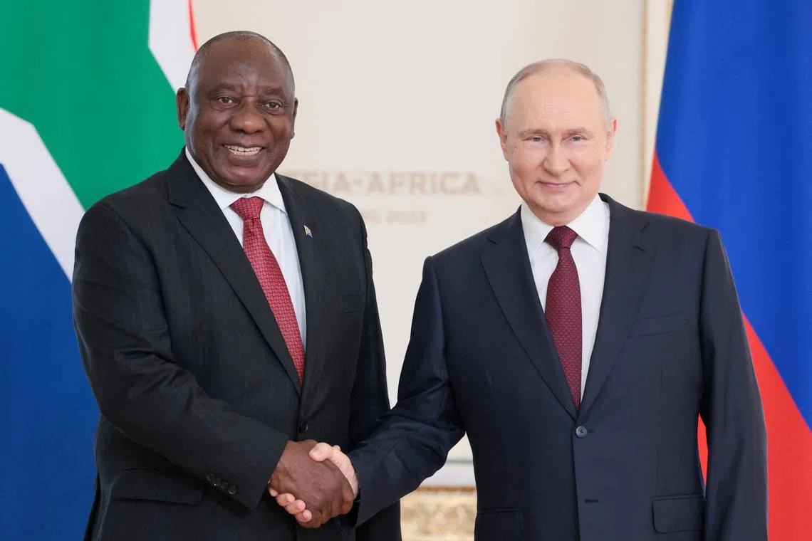 FILE PHOTO: Russian President Vladimir Putin shakes hands with South African President Cyril Ramaphosa during their meeting following the Russia-Africa summit in Saint Petersburg, Russia, July 29, 2023. Mikhail Metzel/TASS Host Photo Agency via REUTERS/File Photo