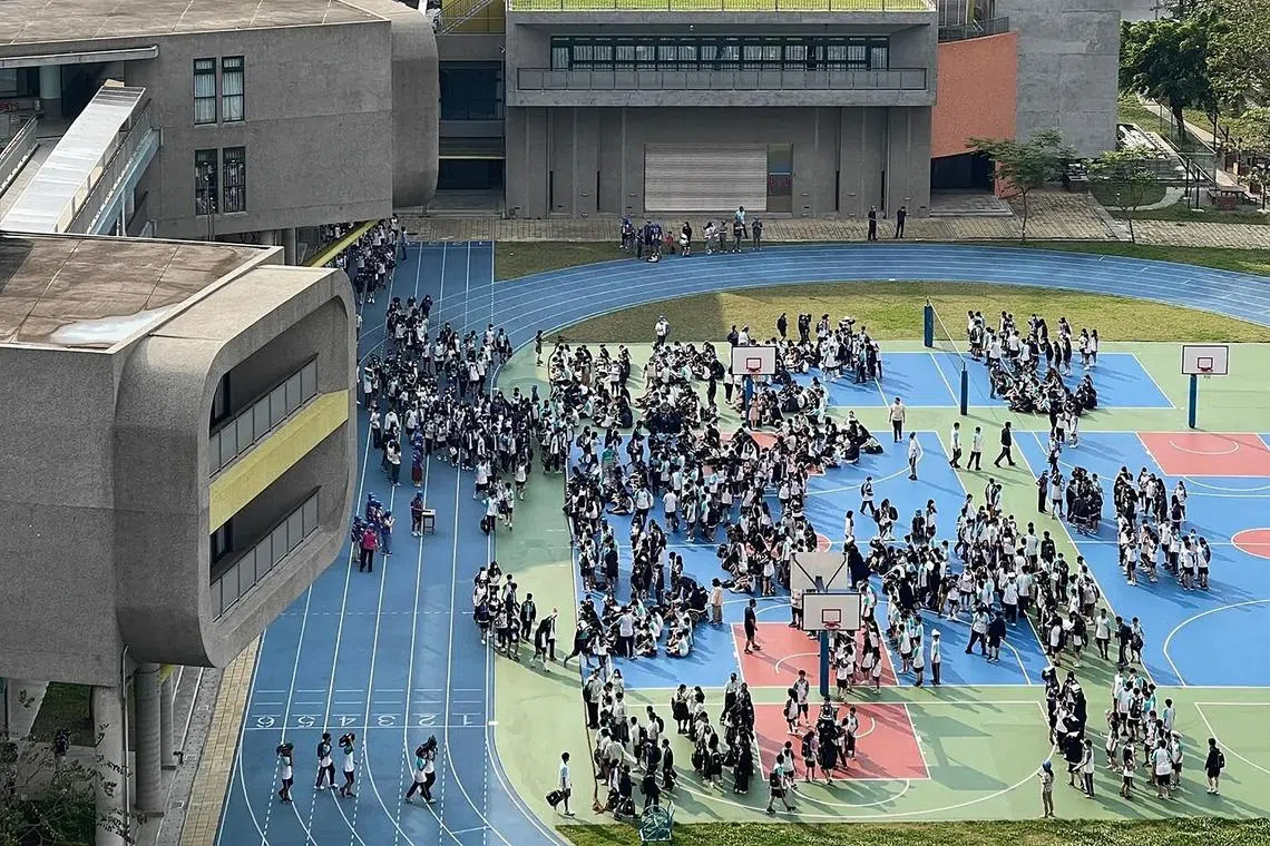 Students evacuating from a school building in Taipei, following a major earthquake in eastern Taiwan on April 3, 2024.
