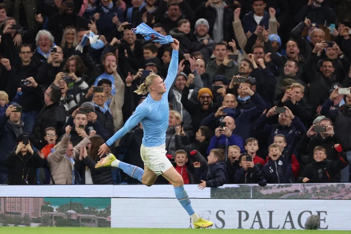 Manchester City's Erling Haaland celebrates after scoring the winner against Fulham.