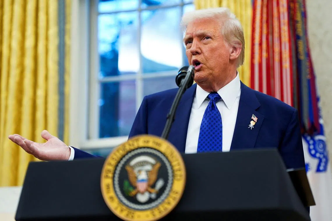 U.S. President Donald Trump speaks, on the day of Tulsi Gabbard's swearing in ceremony as Director of National Intelligence, in the Oval Office at the White House in Washington, D.C., U.S., February 12, 2025. REUTERS/Nathan Howard/File Photo