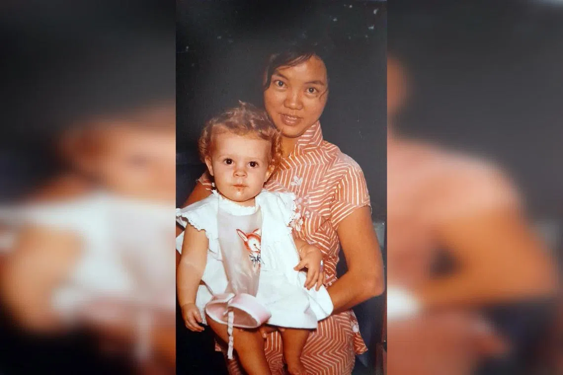 Ms Sara McGaughey with her amah Tan Siew Khim on her first birthday in the 1960s.