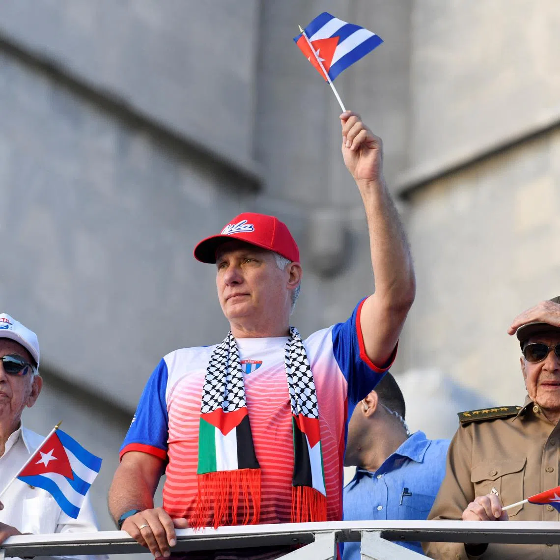 Cuba's former President Raul Castro, Cuba's President and First Secretary of the Communist Party Miguel Diaz-Canel and Cuba's former Vice President Jose Ramon Machado watch a May Day rally in Havana, Cuba May 1, 2025. REUTERS/Norlys Perez