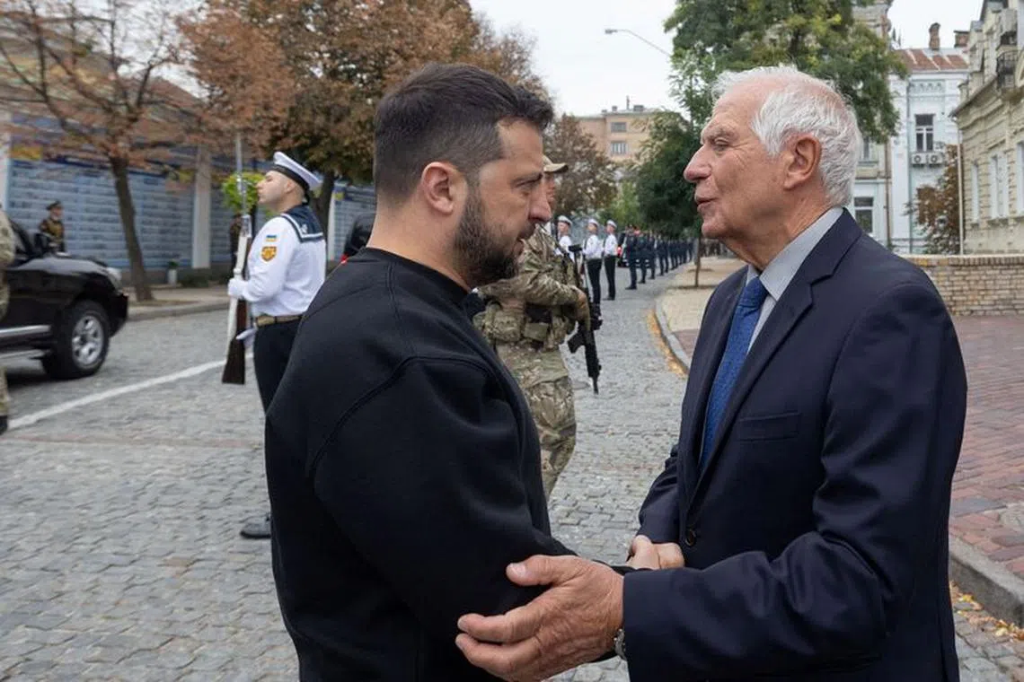Ukraine's President Volodymyr Zelenskiy speaks with European Union Foreign Policy Chief Josep Borrell as they visit the Memory Wall of Fallen Defenders of Ukraine, amid Russia's attack on Ukraine, during the marking of Defenders of Ukraine Day in Kyiv, Ukraine October 1, 2023.  Ukrainian Presidential Press Service/Handout via REUTERS ATTENTION EDITORS - THIS IMAGE HAS BEEN SUPPLIED BY A THIRD PARTY.