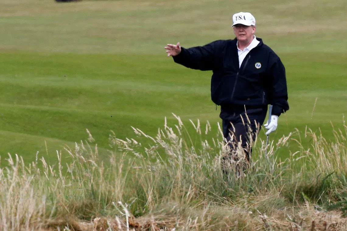 FILE PHOTO: Donald Trump gestures as he walks on the course of his golf resort, in Turnberry, Scotland  July 14, 2018.  REUTERS/Henry Nicholls/File Photo