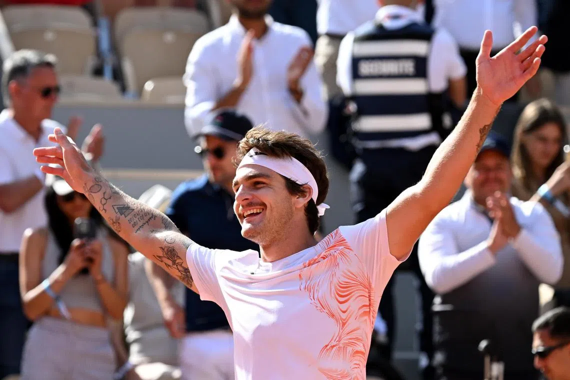 Thiago Seyboth Wild of Brazil celebrates after defeating world No. 2 Daniil Medvedev in the first round of the French Open on Tuesday.