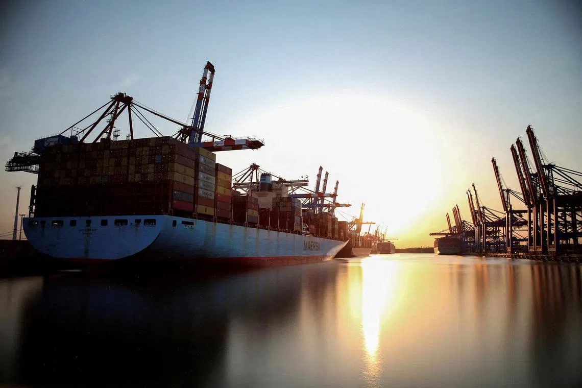 FILE PHOTO: Cargo ships are loaded at container terminals at the harbour in Hamburg, Germany, July 19, 2022. REUTERS/Cathrin Mueller/File Photo