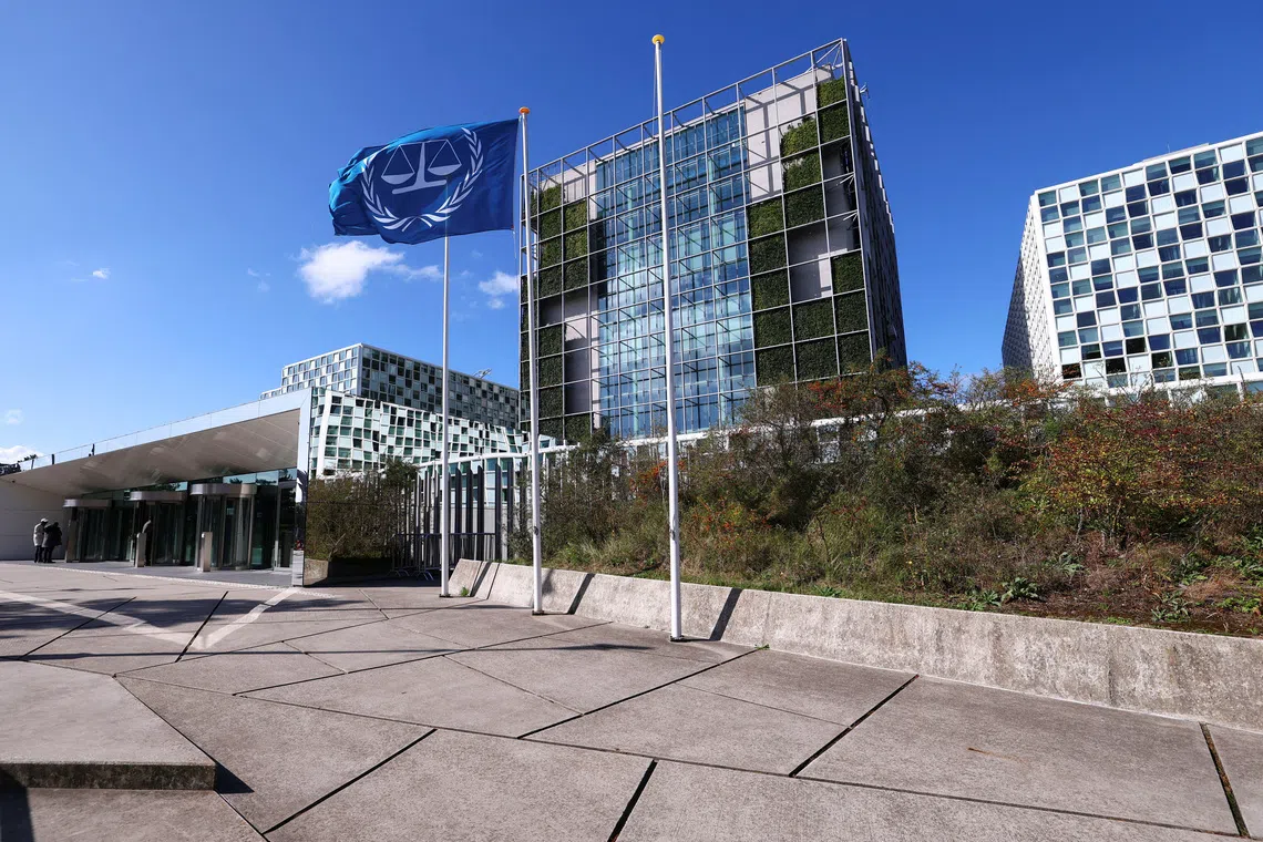 People stand outside the International Criminal Court (ICC) as the United States is considering imposing sanctions as soon as this week against the entire International Criminal Court, in The Hague, Netherlands, September 22, 2025. REUTERS/Piroschka van de Wouw