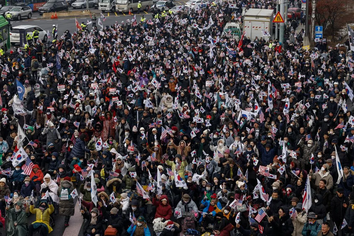Pro-Yoon protesters attend a rally in support of impeached South Korean President Yoon Suk Yeol near his official residence, in Seoul, South Korea, January 6, 2025. REUTERS/Tyrone Siu