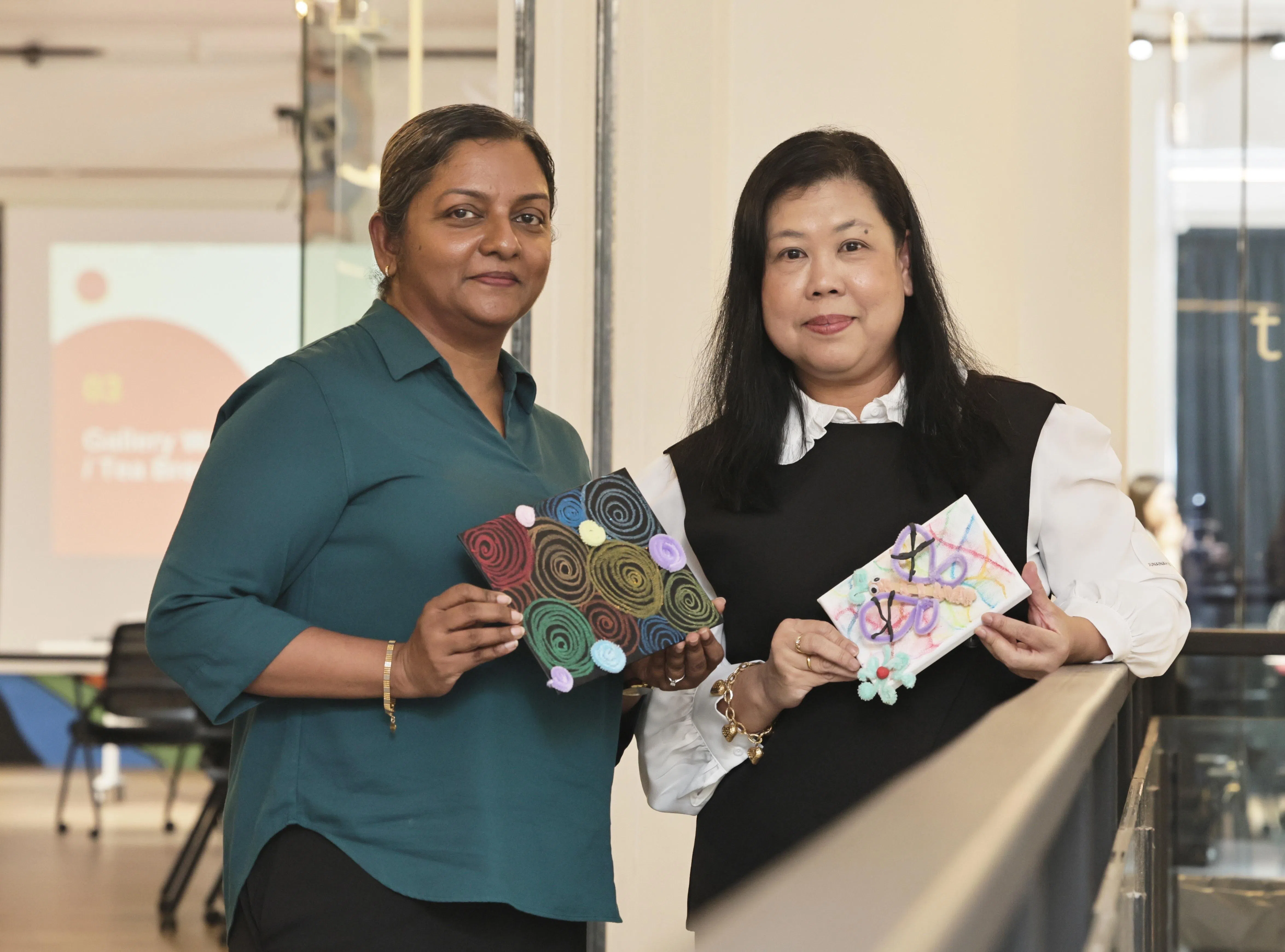 Thilaga Piireasamy (left) and Junainah Haron at the inaugural session of the new art therapy programme on Oct 29.