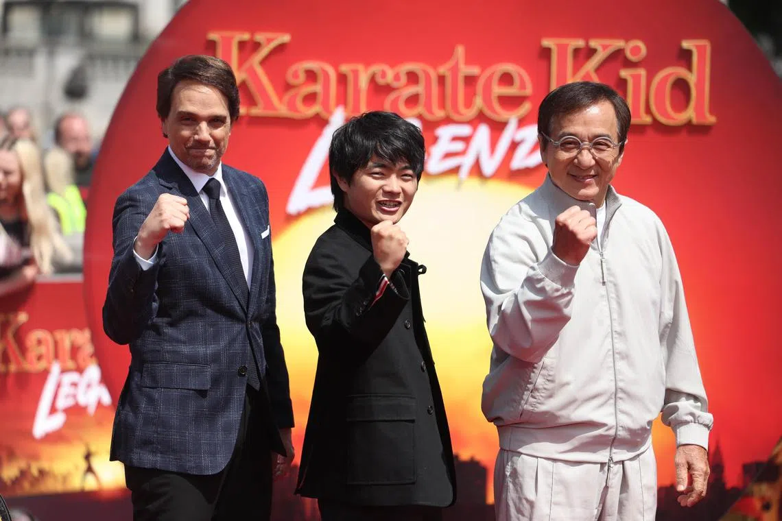 epa12119341 (L-R) Actors and cast members Ralph Macchio, Ben Wang and Jackie Chan attend a photocall to promote their film 'Karate Kid Legends' at Trafalgar Square in London, Britain, 20 May 2025. The film is realised in UK and Ireland on 28 May 2025.  EPA-EFE/NEIL HALL
