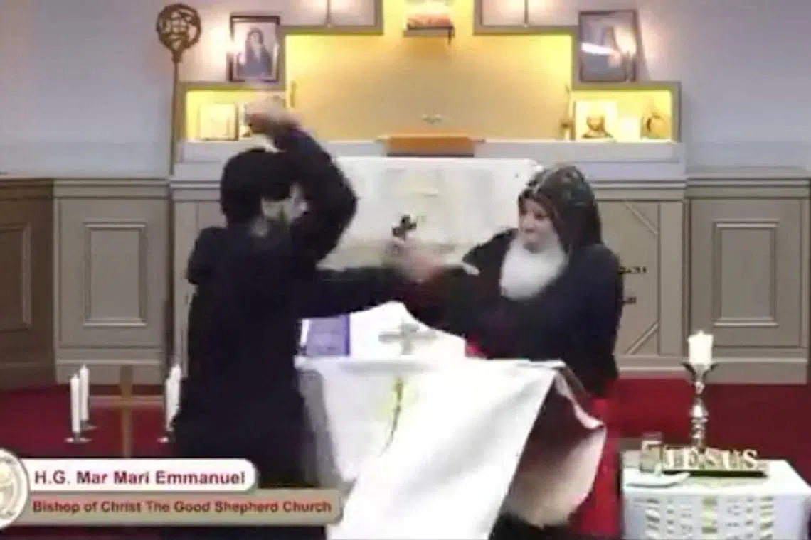 A screenshot of a video shows the attacker approaching Bishop Mar Mari Emmanuel as he was holding service.