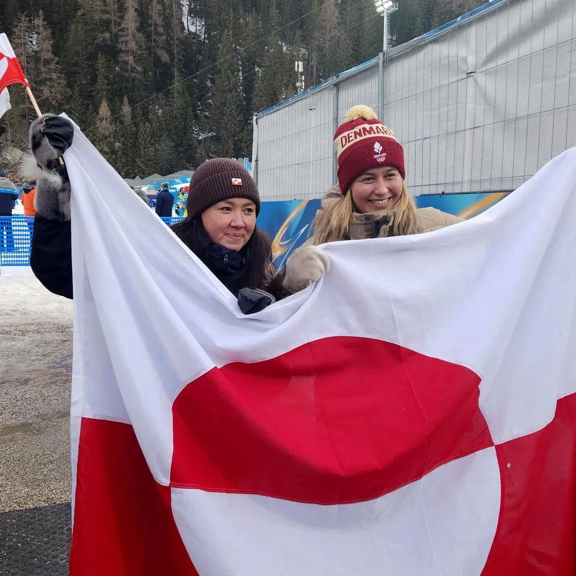 Milano Cortina 2026 Winter Olympics - Biathlon - Anterselva Biathlon Arena, South Tyrol, Italy - February 11, 2026 Greenland culture minister Nivi Olsen and Ukaleq Slettemark of Denmark pose for a photo REUTERS/Phillip O’Connor