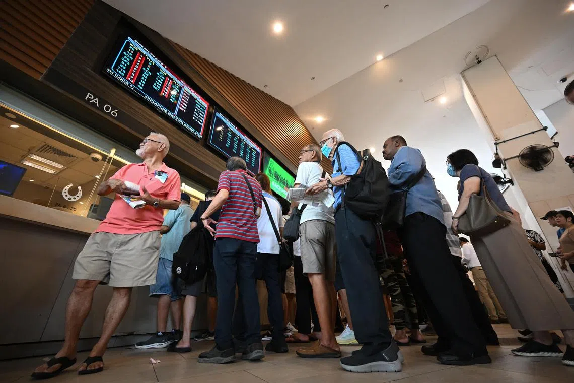 Punter queuing to place their bets at Singapore Turf Club on Oct 5, 2024. 