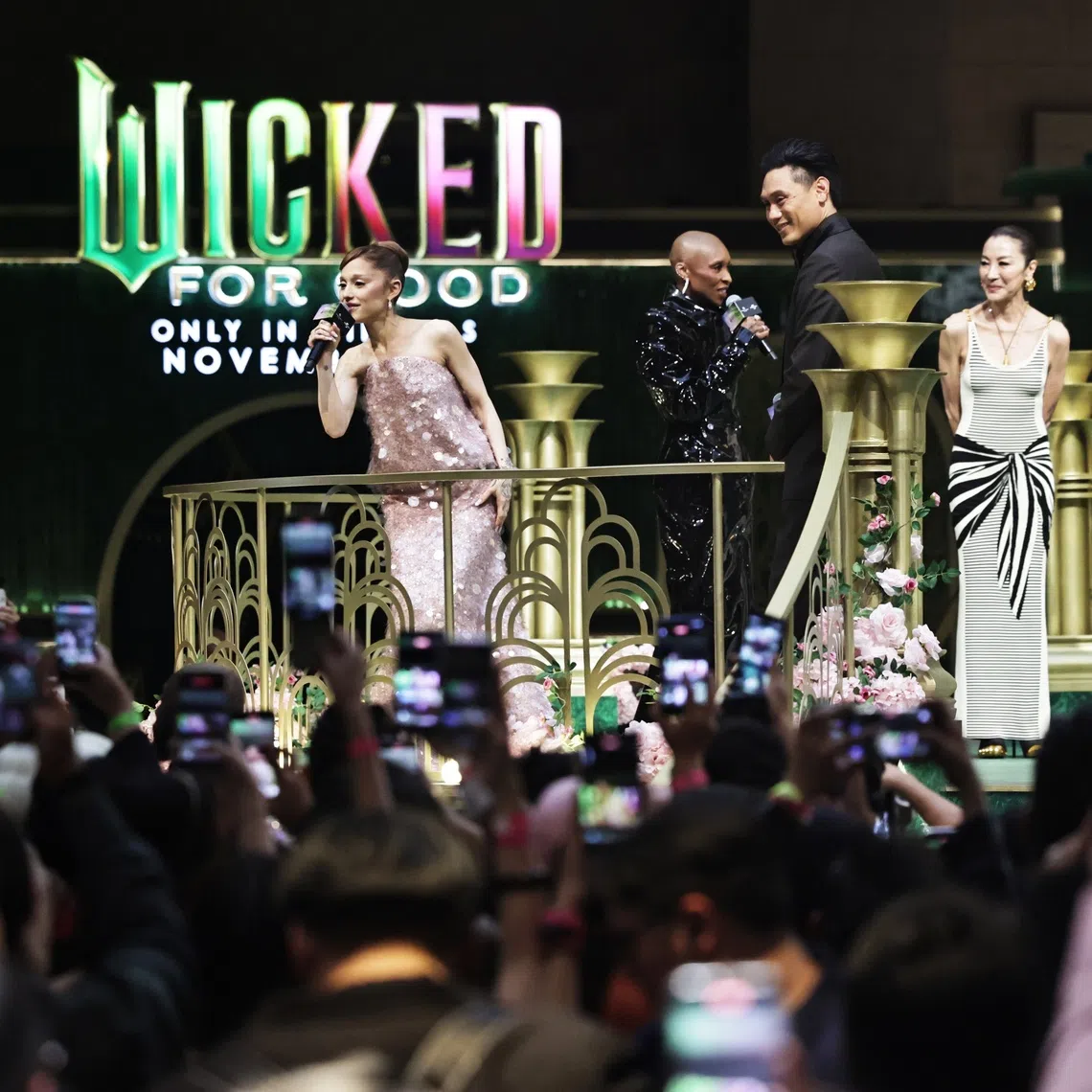 From left- Ariana Grande, Cynthia Erivo, director Jon M Chu, Michelle Yeoh and Jeff Goldblum greeting fans at RWS Weave before the premiere for Wicked: For Good in Universal Studios Singapore on Nov 13, 2025.