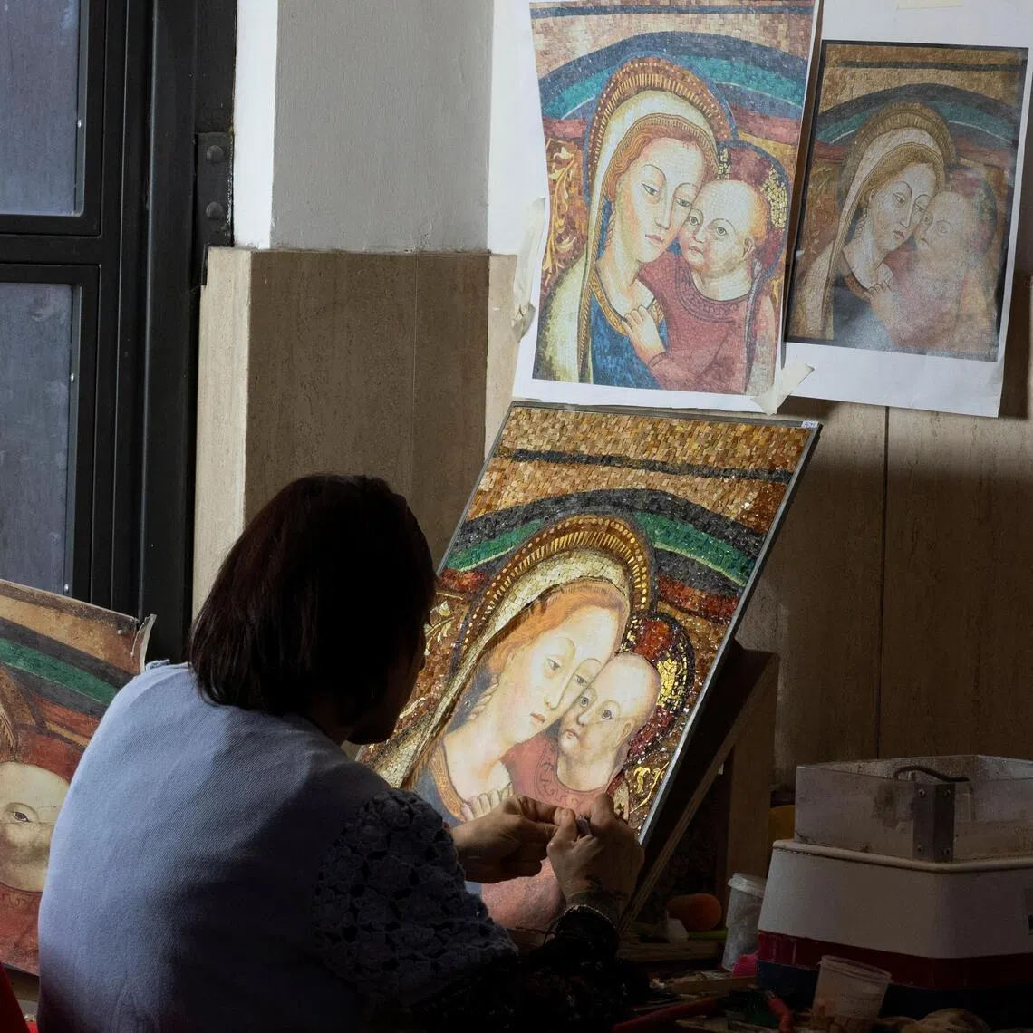 It takes months for the studio to create one mosaic in a slow and intensive process piecing together tiny coloured tiles into devotional items.