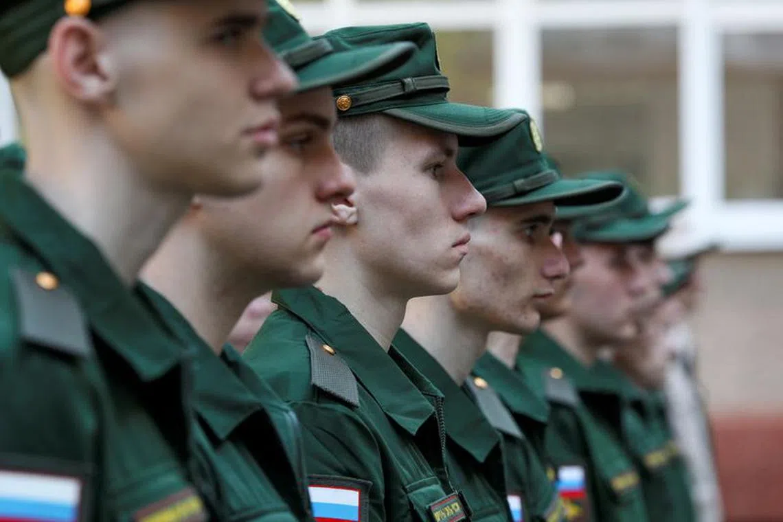 FILE PHOTO: Russian conscripts called up for military service line up before their departure for garrisons as they gather at a recruitment centre in Simferopol, Crimea, April 25, 2023. REUTERS/Alexey Pavlishak/File Photo