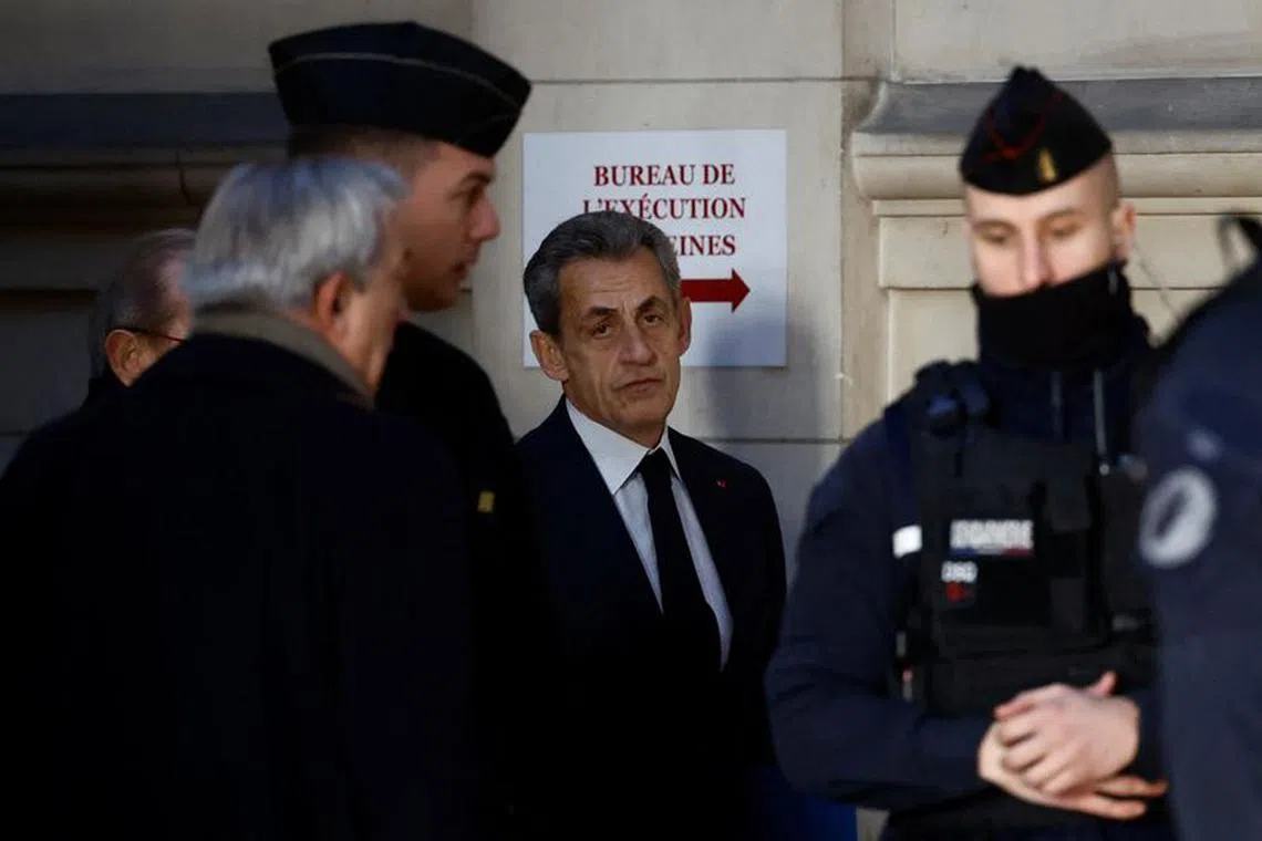 Former French President Nicolas Sarkozy arrives for his appeal trial on charges of corruption and influence peddling, at Paris courthouse, France, December 15, 2022. REUTERS/Stephane Mahe/File Photo