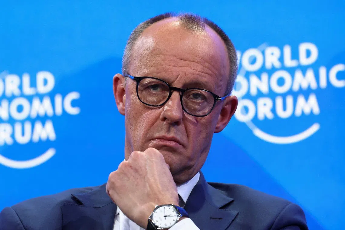 German conservative candidate for chancellor and Christian Democratic Union (CDU) leader Friedrich Merz reacts during the 55th annual World Economic Forum (WEF) meeting in Davos, Switzerland, January 21, 2025. REUTERS/Yves Herman