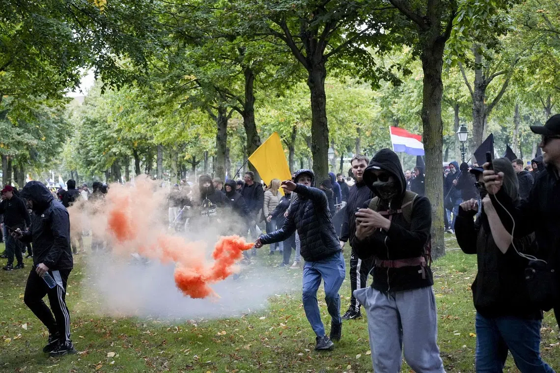 Protesters pelted Dutch riot police with fireworks and other projectiles after chanting anti-Semitic slogans at a rally in the centre of The Hague on Sept 19.