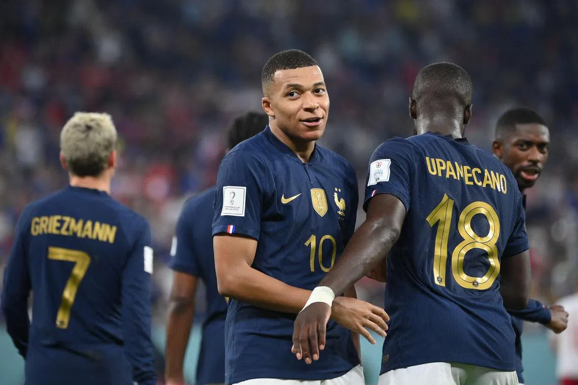 France's Kylian Mbappe (centre) celebrates scoring a second goal for France against Denmark.
