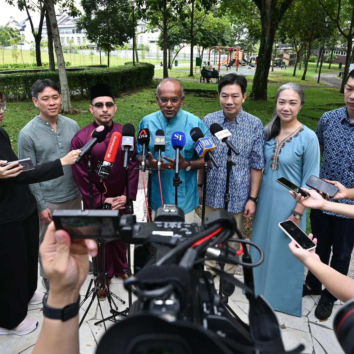 (From left) MP Louis Ng, Dr Syed Harun Alhabsyi, Law and Home Affairs Minister K. Shanmugam, MP Carrie Tan, MP Derrick Goh and Mr Jackson Lam speaking to the media outside Ahmad Ibrahim Mosque on March 31.