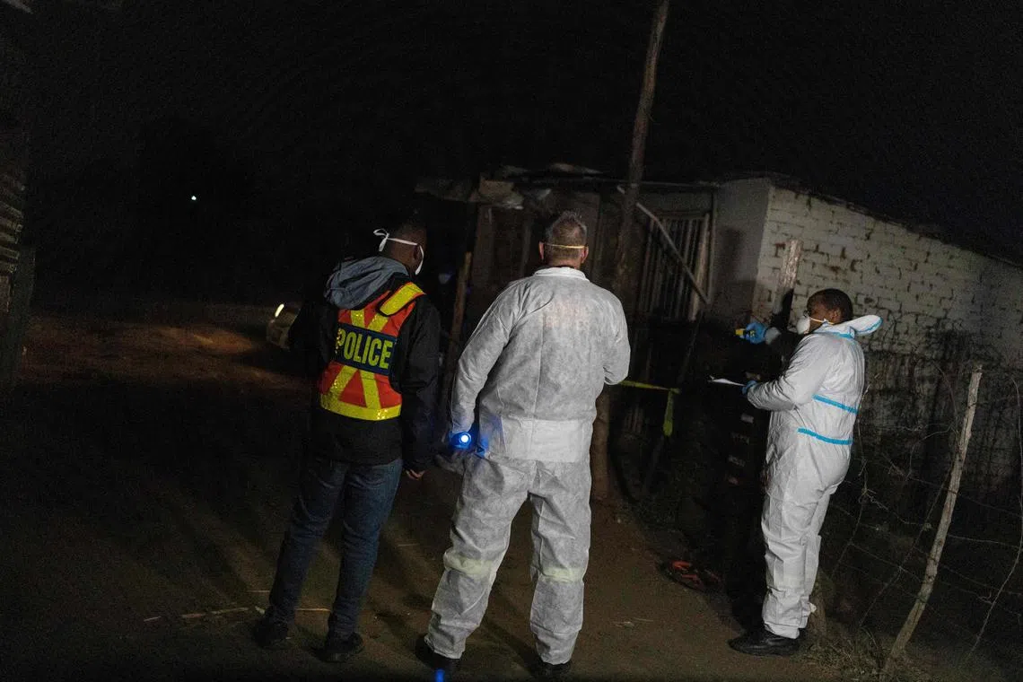 South African Police Service forensic team at the scene of a gas leak at the Angelo informal settlement in Boksburg on July 6. 