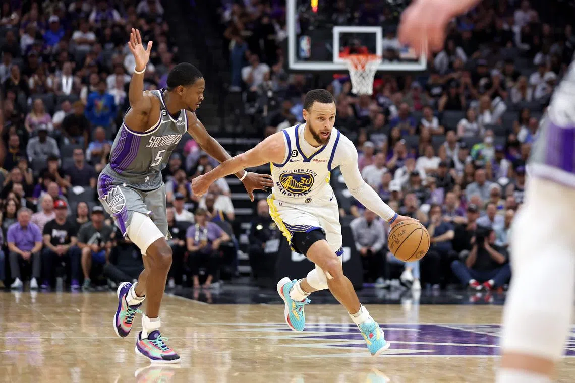 Stephen Curry of the Golden State Warriors is guarded by De'Aaron Fox of the Sacramento Kings during the second half of Game 5 of their NBA play-offs.
